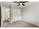 Bedroom featuring carpet, fan, and closet at 9306 E Fairbrook St, Mesa, AZ 85207