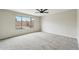 Bedroom with carpet flooring, and views to the backyard and pool at 9306 E Fairbrook St, Mesa, AZ 85207