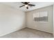 Bedroom with carpet flooring, a ceiling fan, and window at 9306 E Fairbrook St, Mesa, AZ 85207