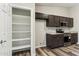 Kitchen area with pantry, granite counters and modern appliances at 9306 E Fairbrook St, Mesa, AZ 85207