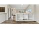 Open concept living room featuring hardwood floors and built in shelving at 9306 E Fairbrook St, Mesa, AZ 85207