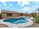 Inviting backyard pool with desert landscaping and blue skies at 9306 E Fairbrook St, Mesa, AZ 85207