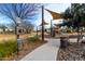 Well-maintained community park offers a pet station, playground, and scenic walking path at 9544 E Theia Dr, Mesa, AZ 85212