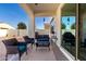 Relaxing covered patio with comfortable seating and lush, low-maintenance landscaping at 9544 E Theia Dr, Mesa, AZ 85212
