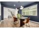 Elegant dining area boasts a modern chandelier, natural light, and seamless access to the staircase at 9544 E Theia Dr, Mesa, AZ 85212