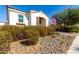 Charming single-story home featuring a well-maintained front yard with desert landscaping and American flag at 9544 E Theia Dr, Mesa, AZ 85212