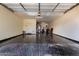 Spacious garage with epoxy flooring, providing ample space for parking and storage at 9544 E Theia Dr, Mesa, AZ 85212