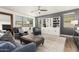 Inviting living room with comfortable seating, stylish decor, ceiling fan, and a decorative built-in shelf at 9544 E Theia Dr, Mesa, AZ 85212