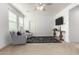 Cozy living room with comfortable seating, a plush rug, and a media console at 9544 E Theia Dr, Mesa, AZ 85212