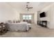 Expansive main bedroom suite with a king bed, a TV, and natural lighting from a window at 9544 E Theia Dr, Mesa, AZ 85212