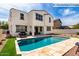Beautiful backyard pool with outdoor kitchen and well-maintained landscaping for relaxing and entertaining at 9544 E Theia Dr, Mesa, AZ 85212