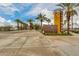 The community has a home finding center and is lined with lush palm trees and sidewalks at 9544 E Theia Dr, Mesa, AZ 85212