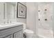 This bathroom features a modern vanity and a glass-enclosed shower with marble tile at 9834 E Voltaire Dr, Scottsdale, AZ 85260