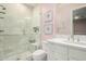 Bright bathroom with modern vanity, frameless mirror, and beautiful walk-in shower at 9834 E Voltaire Dr, Scottsdale, AZ 85260