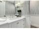 Elegant bathroom features a white marble countertop, chrome hardware and decorative wall design at 9834 E Voltaire Dr, Scottsdale, AZ 85260