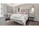 Serene bedroom with a sitting area, wood floors, plush bedding, and ample natural light at 9834 E Voltaire Dr, Scottsdale, AZ 85260