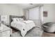 This bedroom features a plush, inviting bed, accent chair, and soft, neutral decor at 9834 E Voltaire Dr, Scottsdale, AZ 85260