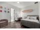 Bedroom with hard wood floors, light-up vanity, and unique decorations at 9834 E Voltaire Dr, Scottsdale, AZ 85260