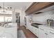 Bright kitchen featuring stainless steel appliances, light countertops, and tiled backsplash at 9834 E Voltaire Dr, Scottsdale, AZ 85260
