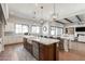 Open kitchen with stainless steel appliances, large island and seamless access to the dining area at 9834 E Voltaire Dr, Scottsdale, AZ 85260