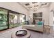Open living room with hardwood floors, decorative ceilings, and a large sliding glass door at 9834 E Voltaire Dr, Scottsdale, AZ 85260