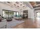 Bright living room features an open floor plan, hardwood floors, and ample natural light at 9834 E Voltaire Dr, Scottsdale, AZ 85260