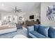 Bright main bedroom showcasing a sitting area, hardwood floors, and neutral tones at 9834 E Voltaire Dr, Scottsdale, AZ 85260