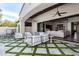 Outdoor living area offering comfortable seating, ceiling fans, with seamless access to indoor living space at 9834 E Voltaire Dr, Scottsdale, AZ 85260