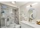 Stylish bathroom showcasing a shower with marble tiling and a vanity for a luxurious feel at 9926 W Lancaster Dr, Sun City, AZ 85351