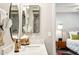 Bright and stylish bathroom featuring a mirror and vanity providing a comfortable and inviting space at 9926 W Lancaster Dr, Sun City, AZ 85351