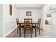 Formal dining room with dark wood table and seating at 9926 W Lancaster Dr, Sun City, AZ 85351
