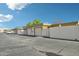 Street view of homes featuring garages and block walls at 9926 W Lancaster Dr, Sun City, AZ 85351