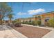 Well-maintained exteriors with lush landscaping and inviting walkways at 9926 W Lancaster Dr, Sun City, AZ 85351