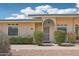 Inviting single-story home with manicured landscaping, secure front entry and lovely walkway at 9926 W Lancaster Dr, Sun City, AZ 85351