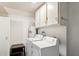 Functional laundry room with washer, dryer, and storage, maximizing space and efficiency at 9926 W Lancaster Dr, Sun City, AZ 85351