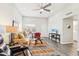 Living room with modern furnishings, ceiling fan, and natural light at 9926 W Lancaster Dr, Sun City, AZ 85351