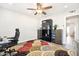 Bright office with a ceiling fan, light hardwood floors, and built-in shelving at 9926 W Lancaster Dr, Sun City, AZ 85351
