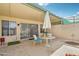 Charming covered patio with outdoor dining set, perfect for relaxing and entertaining at 9926 W Lancaster Dr, Sun City, AZ 85351