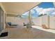 Covered patio with a table, chairs, and a lounge chair at 9926 W Lancaster Dr, Sun City, AZ 85351