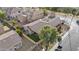 Lovely aerial view of a single Gathering home with a green backyard, privacy fence, and mature trees at 1049 S Exeter St, Chandler, AZ 85286