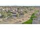 Scenic aerial view of a residential neighborhood with mature trees and mountain views at 1049 S Exeter St, Chandler, AZ 85286