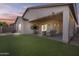 Outdoor living space featuring a covered patio and well-manicured lawn at 1049 S Exeter St, Chandler, AZ 85286