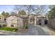 Charming single-story home with manicured landscaping and a spacious driveway leading to an attached garage at 1049 S Exeter St, Chandler, AZ 85286