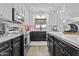 Updated kitchen with white cabinets, sleek countertops, and modern appliances at 1049 S Exeter St, Chandler, AZ 85286