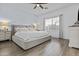 Neutral main bedroom with a platform bed, side tables, and a window with blinds at 1049 S Exeter St, Chandler, AZ 85286
