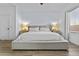 Neutral main bedroom with a platform bed, side tables, and a large window for natural light at 1049 S Exeter St, Chandler, AZ 85286