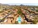 Overhead view showcasing the community pool, well-maintained buildings, and surrounding landscape at 11500 E Cochise Dr # 1094, Scottsdale, AZ 85259