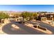 Gated community entrance with desert landscaping and mountain views at 11500 E Cochise Dr # 1094, Scottsdale, AZ 85259