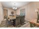 Elegant dining room with chandelier lighting, a large table, and comfortable wicker chairs at 11500 E Cochise Dr # 1094, Scottsdale, AZ 85259