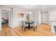 Bright dining area with wood floors and modern chandelier at 11500 E Cochise Dr # 1094, Scottsdale, AZ 85259